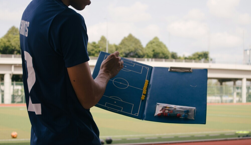 coach with soccer board