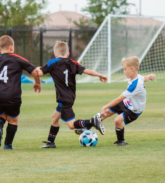 young player dribbling